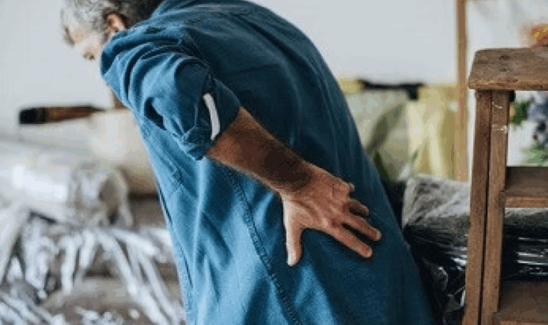 Man clutching his lower back in pain, representing back and disc injury cases handled by L.A. LAW for accident victims in Connecticut.