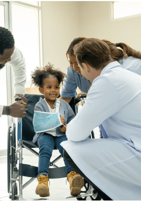 Child Injury Lawyer Connecticut speaking with parents and injured child in wheelchair after accident